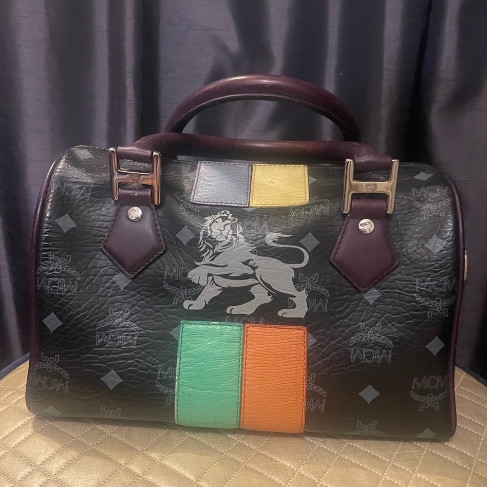 MCM Lioness Black Leather Boston Bag with Multicolor Accents.